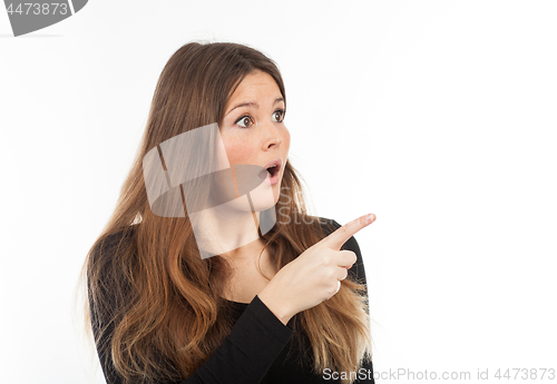Image of Beautiful young woman showing blank signboard