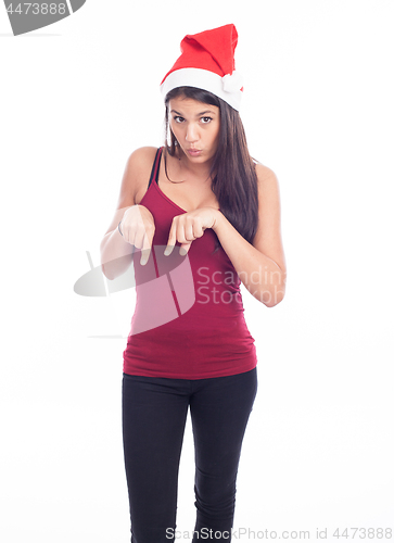 Image of Happy christmas woman pointing