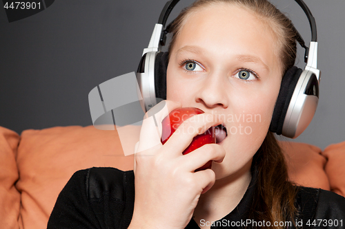 Image of happy girl listening to music