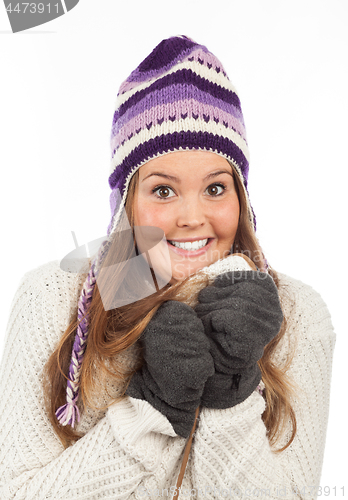 Image of Face of pretty woman with gloves and knitted winter cap  with smile