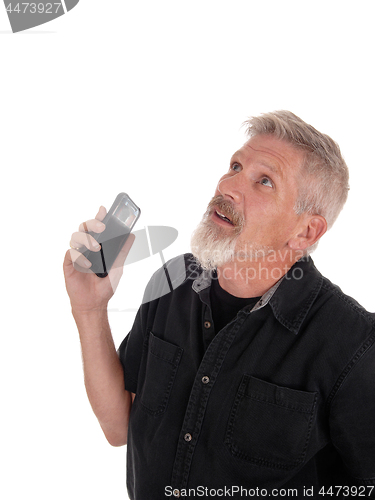 Image of Middle age man frustrated with his phone