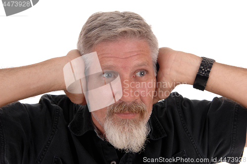 Image of Man holding his hands over his ears