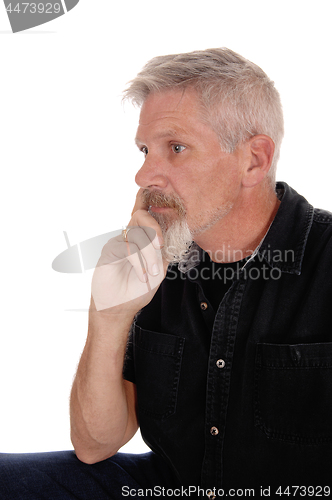 Image of Middle aged man with hand on chin