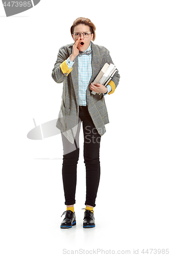 Image of Full length portrait of a sad female student holding books isolated on white background