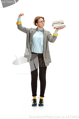 Image of Full length portrait of a sad female student holding books isolated on white background