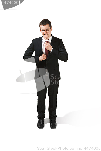 Image of Above front portrait of a businessman with very serious face. Confident professional with piercing look in the foreground of the camera.