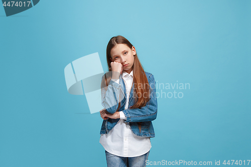 Image of Young serious thoughtful teen girl. Doubt concept.