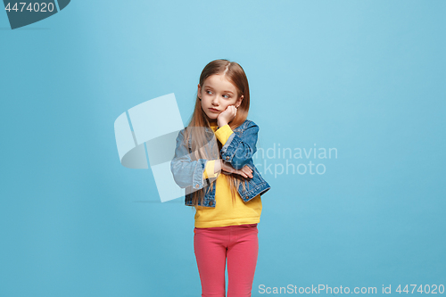 Image of Beautiful teen girl looking suprised and bewildered isolated on pink