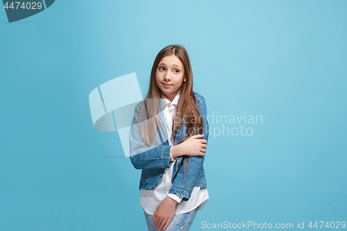 Image of Young serious thoughtful teen girl. Doubt concept.