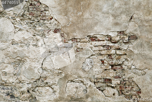 Image of Old wall with brickwork under plaster