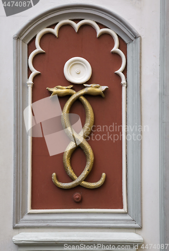 Image of Wall decoration of two tangled snakes