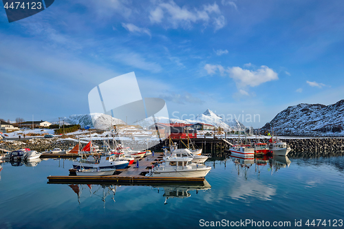 Image of Fishing boats and yachts on pier in Norway