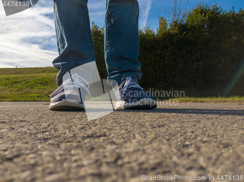 Image of man feet on cobbled road