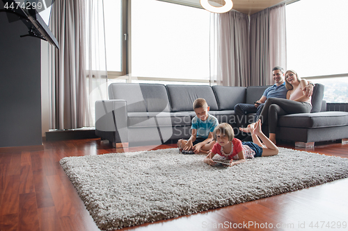 Image of couple spending time with kids