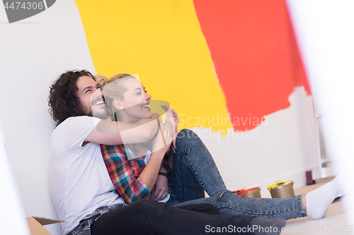 Image of Happy young couple relaxing after painting