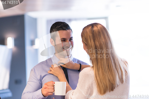 Image of A young couple is preparing for a job and using a laptop