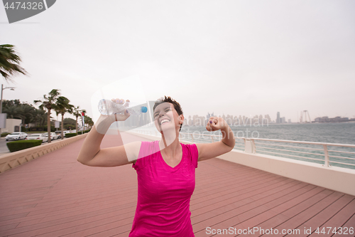 Image of young woman celebrating a successful training run