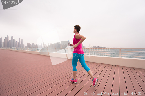 Image of woman running on the promenade