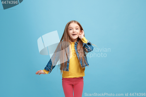 Image of The happy teel girl standing and listening