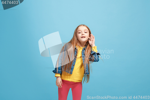 Image of The happy teel girl standing and listening