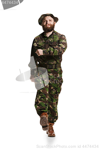 Image of Young army soldier wearing camouflage uniform isolated on white