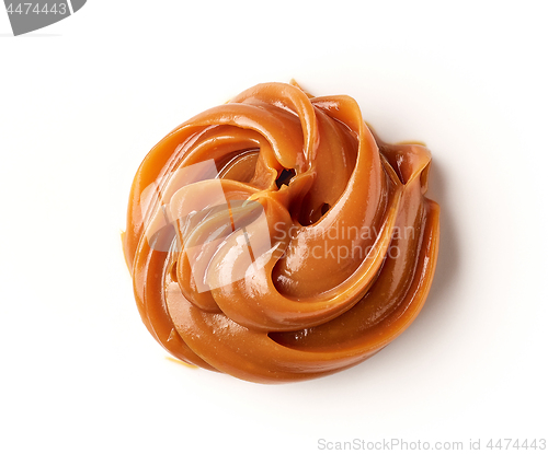 Image of melted caramel on a white background