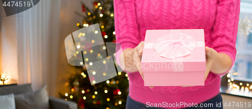 Image of close up of woman hands holding christmas gift