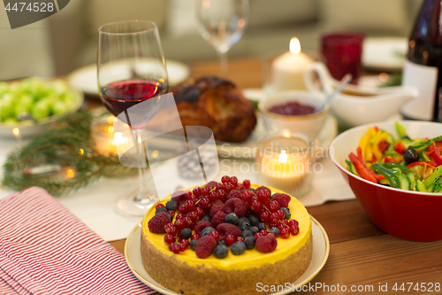 Image of cake and other food on christmas table at home