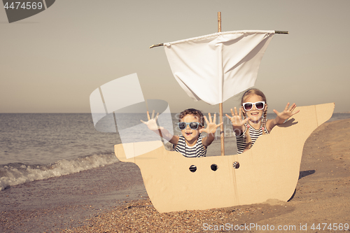 Image of Happy children playing on the beach at the day time.