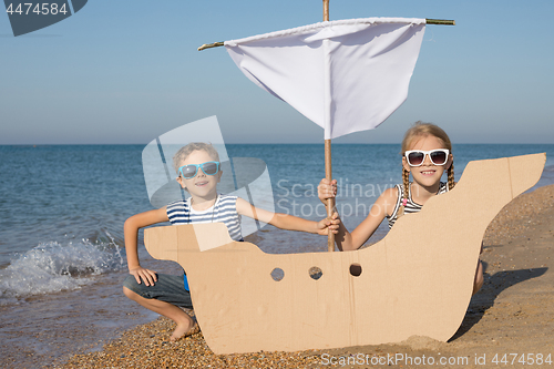 Image of Happy children playing on the beach at the day time.