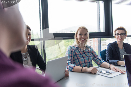 Image of Group of young people meeting in startup office