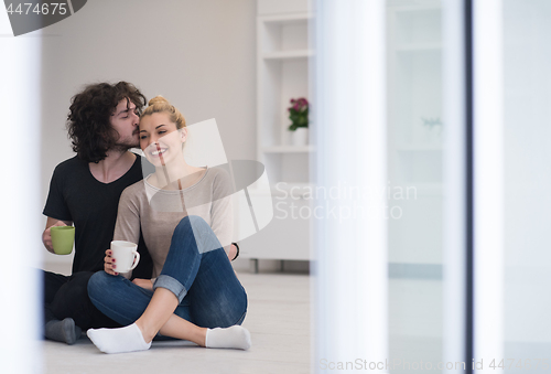 Image of young couple in their new home