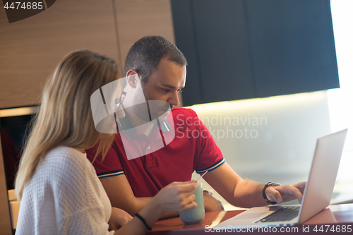 Image of happy young couple buying online