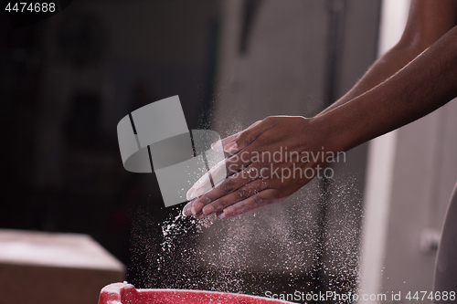 Image of black woman preparing for climbing workout