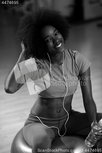 Image of woman  relaxing after pilates workout