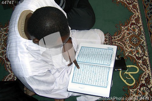 Image of Mussulman praying the Koran