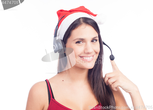 Image of Christmas headset woman from telemarketing call center wearing red santa hat talking smiling isolated on white background.