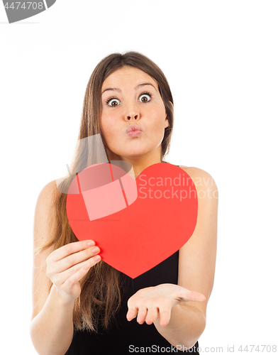 Image of young woman in love with a heart in hand