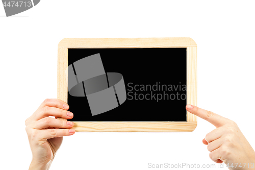 Image of woman\'s hands holding a blackboard publicity