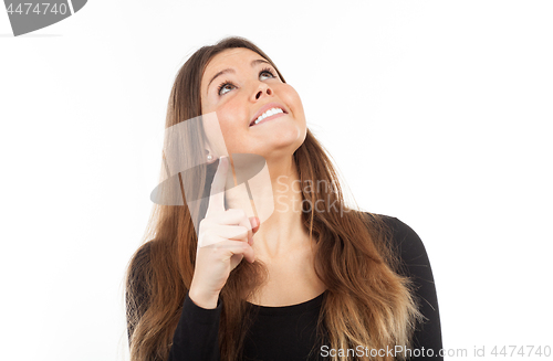 Image of Beautiful young woman showing blank signboard