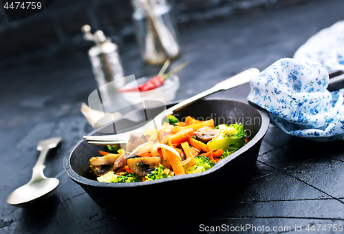 Image of fried mushrooms with vegetables