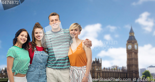 Image of happy friends over houses of parliament in london