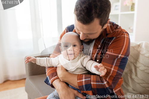 Image of close up of father with little baby boy at home