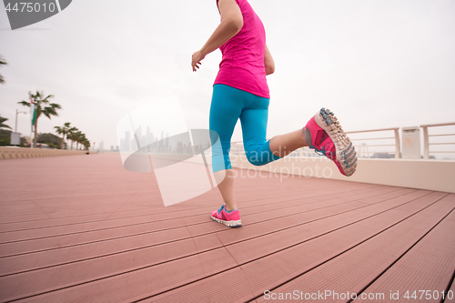 Image of woman running on the promenade