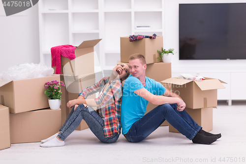 Image of young couple moving  in new house