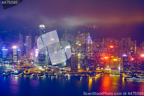 Image of Aerial view of illuminated Hong Kong skyline. Hong Kong, China