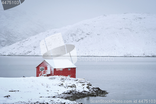 Image of Red rorbu house in winter, Lofoten islands, Norway