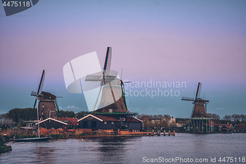 Image of Windmills at Zaanse Schans in Holland in twilight after sunset.