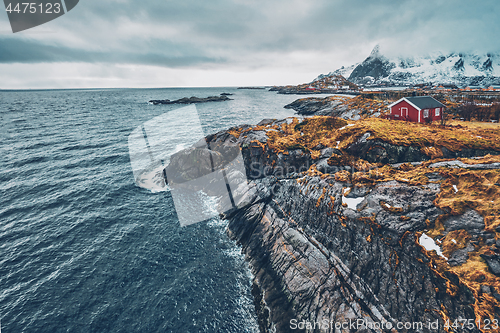 Image of Clif with traditional red rorbu house on Lofoten Islands, Norway