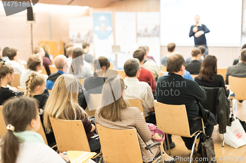 Image of Business speaker giving a talk at business conference event.